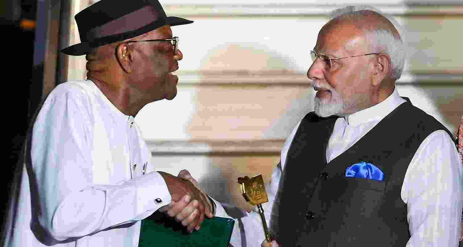 Prime Minister Narendra Modi being presented the ‘Key to the City’ by Nigerian Minister of the Federal Capital Territory Nyesom Ezenwo Wike upon his arrival at the airport, in Abuja, Nigeria. 
