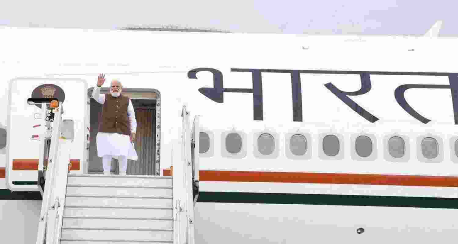 PM Modi boarding a plane earlier this year. FIle Photo,