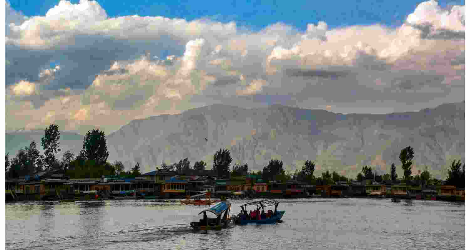 Tourists ride 'Shikaras' at the Dal Lake, seen a day after the Pahalgam terror attack, in Srinagar, Wednesday, April 23. 