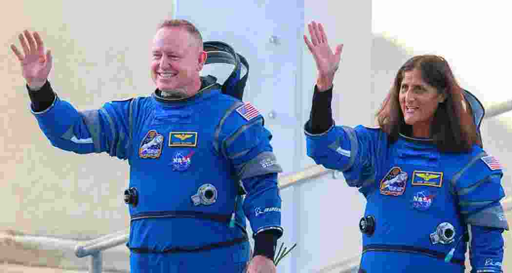 NASA’s Boeing Crew Flight Test Commander Butch Wilmore (L) and Pilot Suni Williams walk out of the Operations and Checkout Building June 05, 2024 in Cape Canaveral, Florida. File photo.