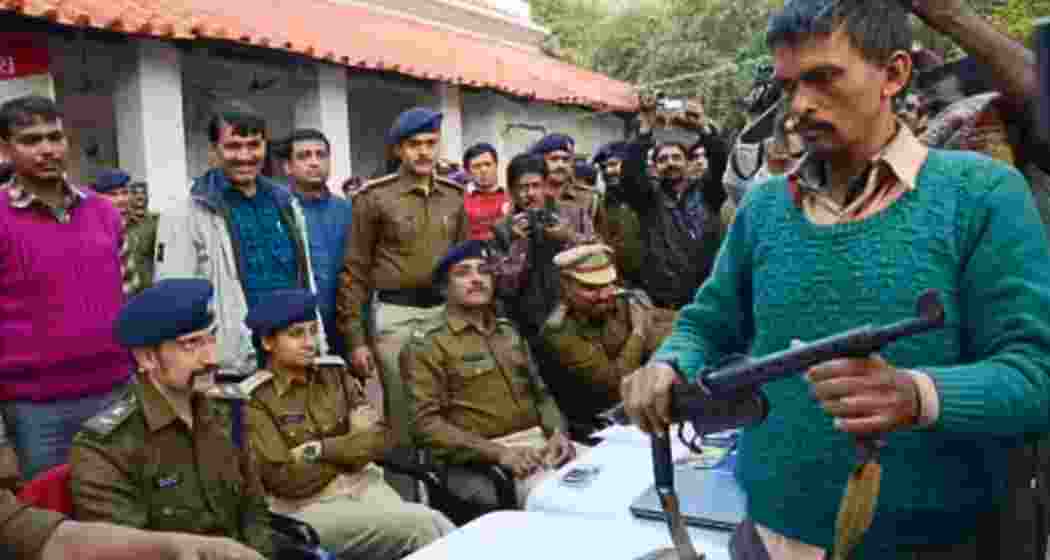 Security officials interact with surrendered Naxalites in Dantewada.