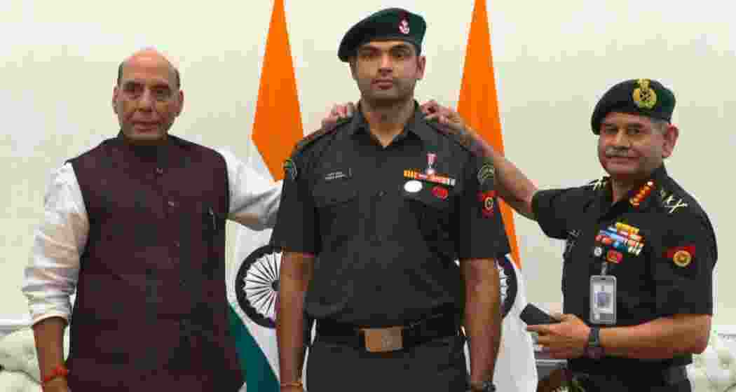 Olympic champion Neeraj Chopra receives the honorary rank of Lieutenant Colonel from Defence Minister Rajnath Singh and Army Chief Gen Upendra Dwivedi at a ceremony in New Delhi.