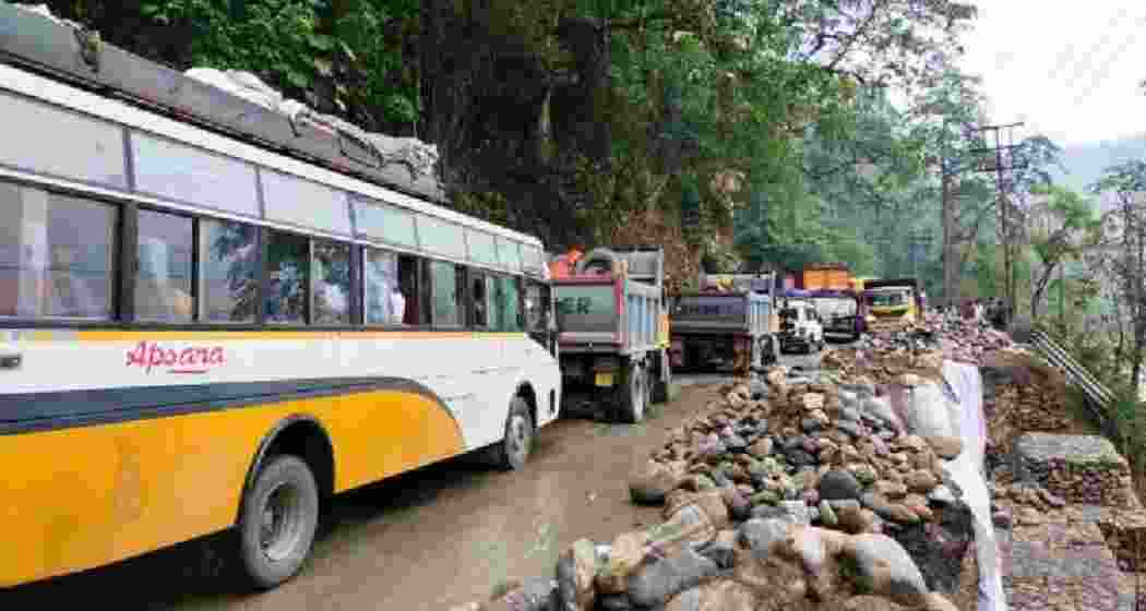 Vehicles stranded on NH-10 as repair work continues, disrupting traffic and causing significant delays.