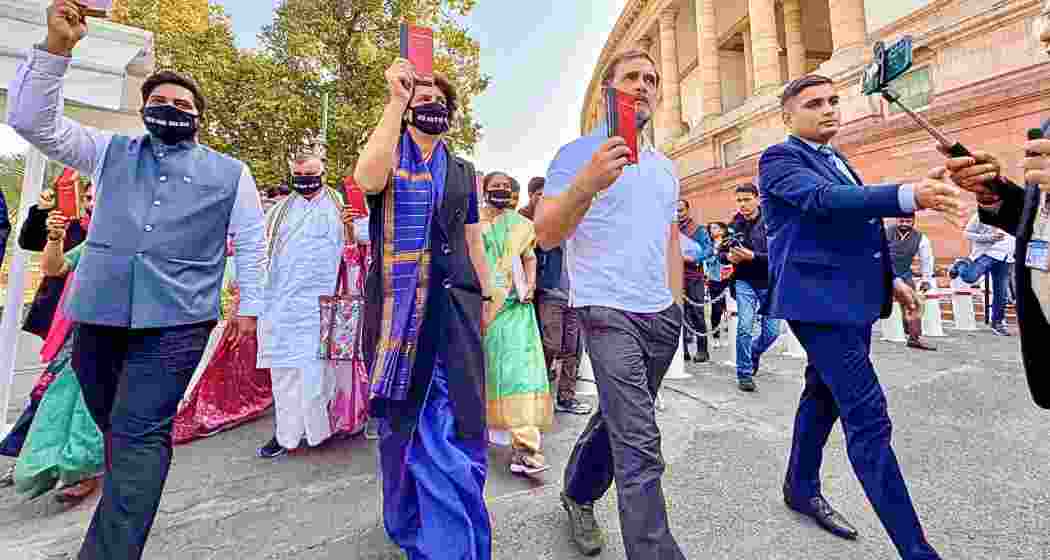 Leader of Opposition in the Lok Sabha Rahul Gandhi and Congress MP Priyanka Gandhi take part in a protest march of opposition MPs over Adani issue during the Winter session of Parliament, in New Delhi, Friday, Dec. 6, 2024. 