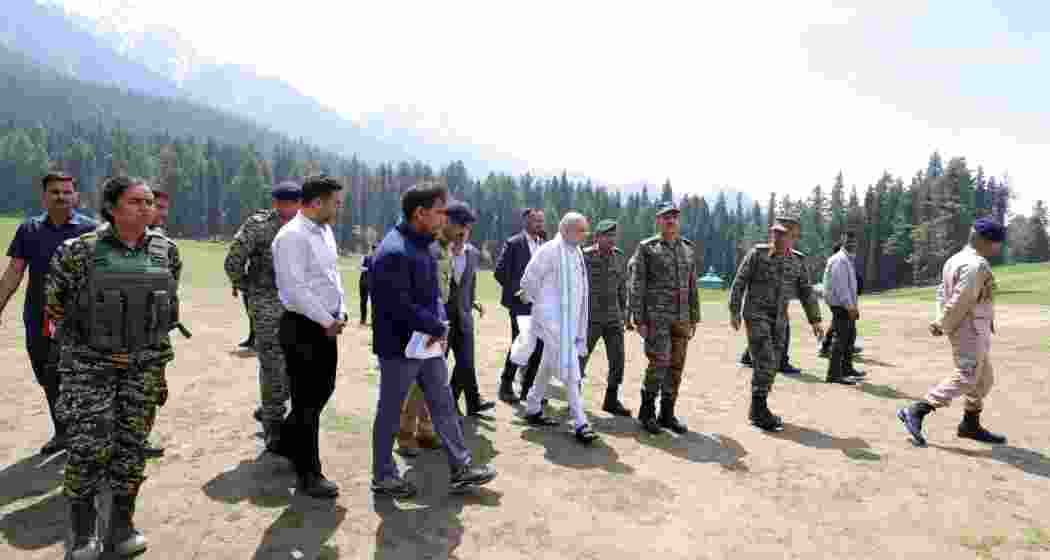 Union Home Minister Amit Shah reviews the Pahalgam meadow with senior Indian Army officials during a visit to the site. Union Home Minister Amit Shah reviews the Pahalgam meadow with senior Indian Army officials during a visit to the site.