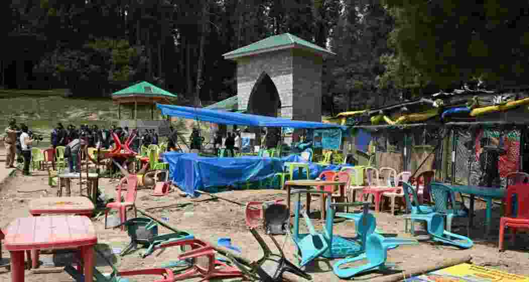 Chairs lying around outside a makeshift shops at Baisaran of Pahalgam where 26 people were killed and several others injured on April 22. 