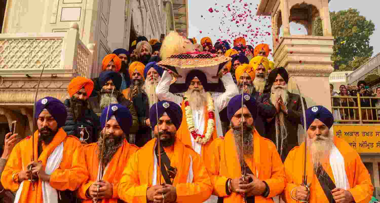 357th Prakash Purab of Shri Guru Gobind Singh Ji
: The designated warriors ‘Panj Pyare’ and Sikh devotees during a 'Nagar Kirtan' procession organised on the eve of the birth anniversary of the 10th Sikh Guru, Guru Gobind Singh, at the Golden Temple in Amritsar. Guru Gobind Singh was born in the year 1666.