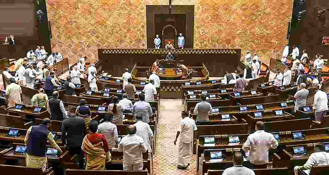 Opposition Members protest in the Rajya Sabha during the Monsoon session of Parliament, in New Delhi, Monday.