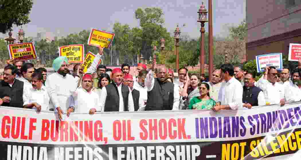 LoP in Rajya Sabha Mallikarjun Kharge, Samajwadi Party MP Akhilesh Yadav, LoP in Lok Sabha Rahul Gandhi and other opposition leaders stage a protest over the West Asia crisis with posters and banners reading, Gulf burning, oil shock. Indians stranded; India needs leadership, not silence, during the second part of Budget session of Parliament, in New Delhi on Monday.