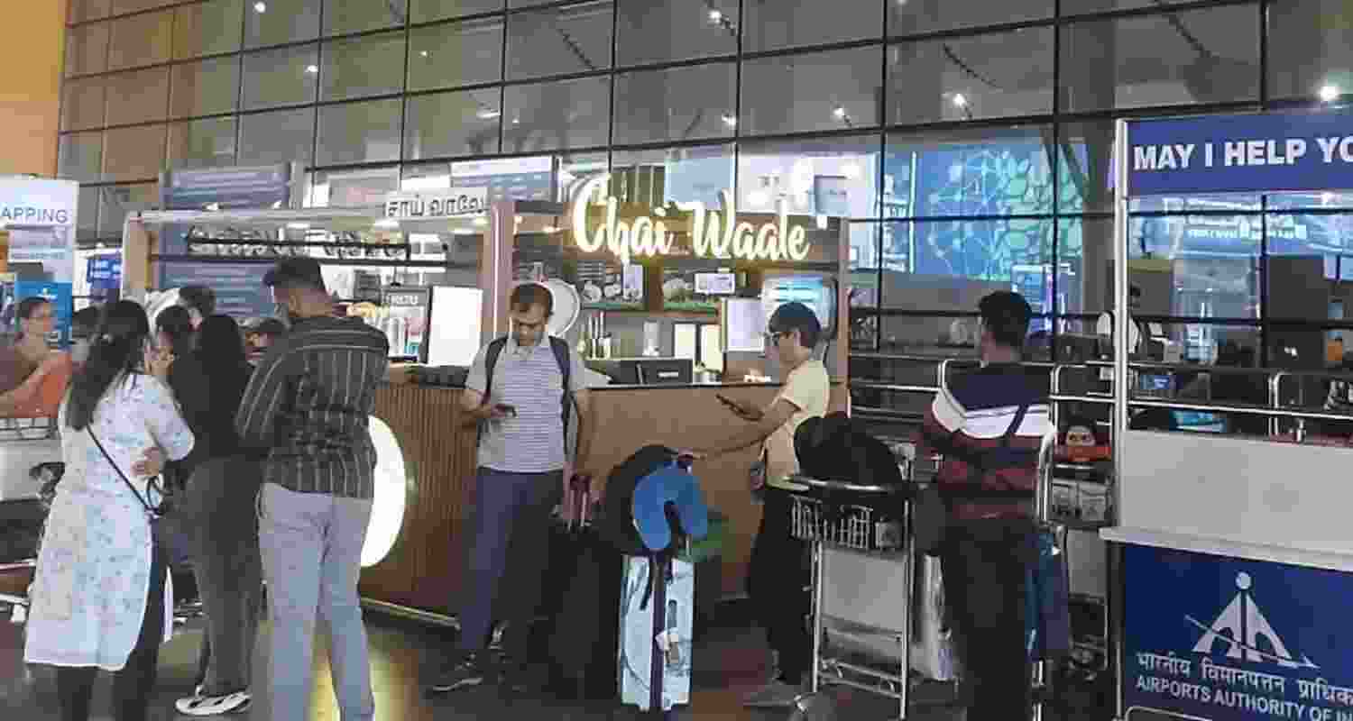 Stranded passengers wait outside Terminal 2, amid cancellation of flights to the Middle East due to the US and Israel strikes on Iran, at the International Airport in Chennai, Tamil Nadu, Saturday. 