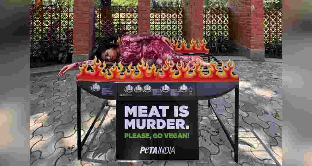 PETA India's 'human barbecue' protest in Guwahati highlights the cruelty of meat consumption and urges a shift to veganism.