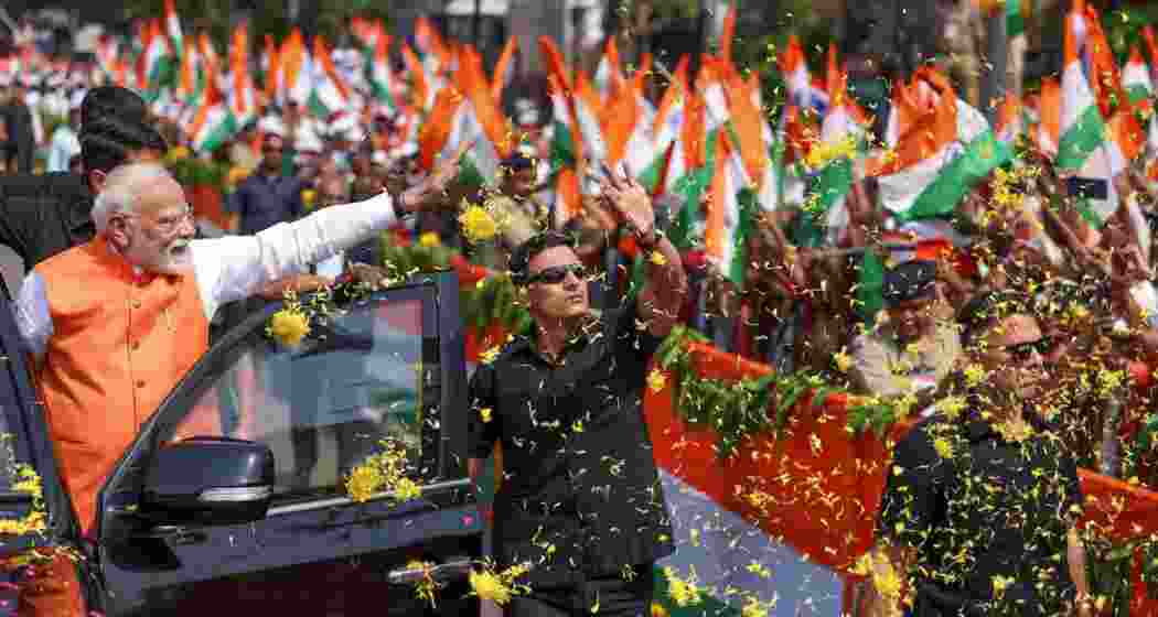 PM Modi during a roadshow in Vadodara, Gujarat. 