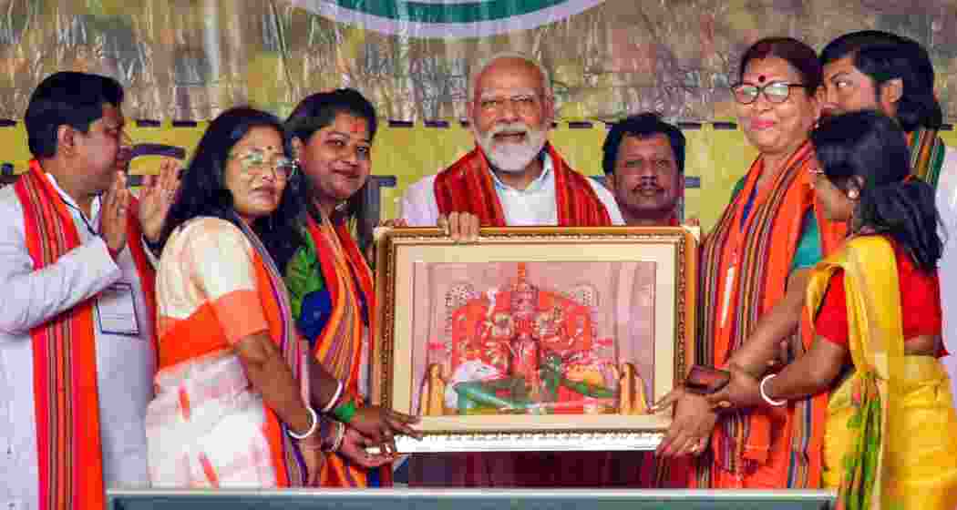 Prime Minister Narendra Modi poses with supporters during a rally for NDA candidates ahead of last year’s Lok Sabha elections, held in Cooch Behar in April.