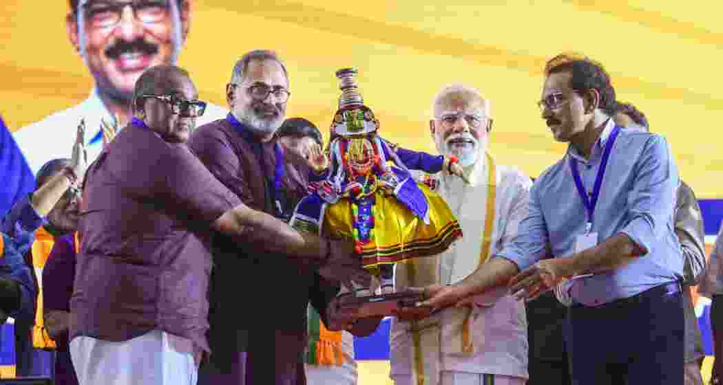 Prime Minister Narendra Modi is felicitated during a public meeting, in Ernakulam, Kerala. BJP state President Rajeev Chandrasekhar and others are also seen.