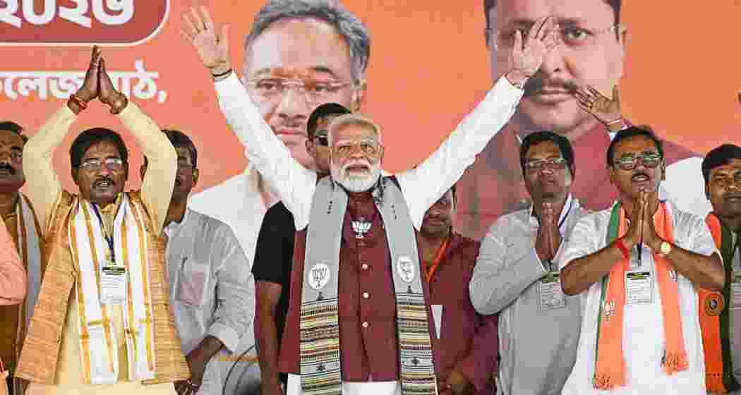 Prime Minister Narendra Modi with party candidates during a public meeting ahead of the West Assembly elections, in Krishnanagar, Nadia district of West Bengal, on Thursday.