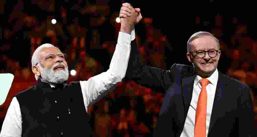 Indian PM Narendra Modi and his Australian counterpart Anthony Albanese at an event at Qudos Bank Arena in Sydney. (AAP Image)