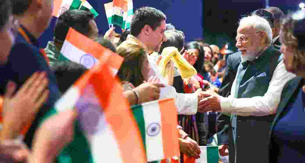 Prime Minister Narendra Modi being greeted by enthusiastic members of the Indian diaspora upon his arrival in Rio de Janeiro to attend the 17th BRICS Summit and a state visit on Saturday.