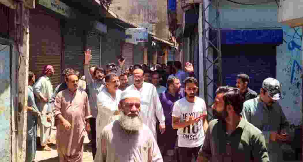 Residents of Pakistan-occupied Jammu & Kashmir stage a protest over decades of infrastructural neglect, demanding accountability, road repairs, healthcare access, and fair allocation of development funds.