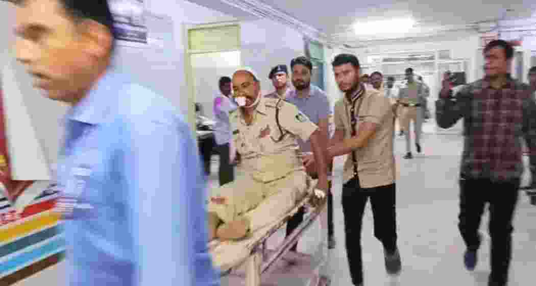 Visuals from the hospital show injured police personnel being carried on a stretcher for medical treatment after a violent mob attack in Mauganj district, Madhya Pradesh.