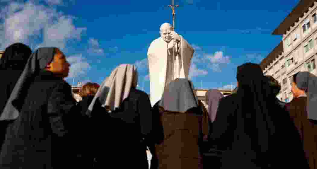 Nuns pray at the statue of John Paul II outside the Gemelli University Hospital where Pope Francis is hospitalised with pneumonia, in Rome on March 02, 2025. (Image: X)