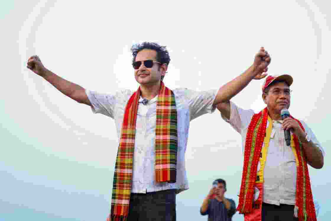 Pradyot Kishore Manikya Debbarma waves to supporters during a campaign rally in Tripura. 