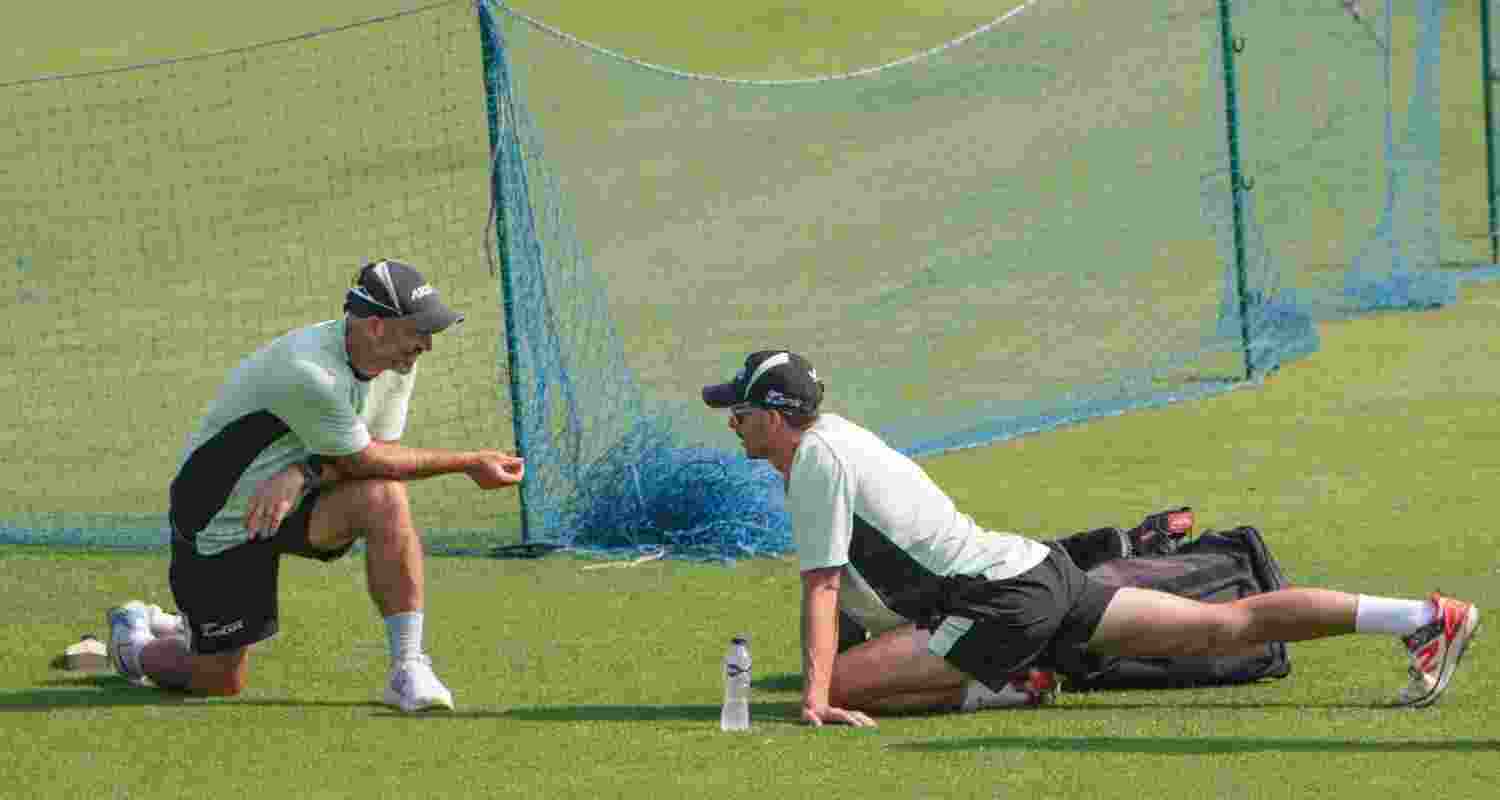 New Zealand's captain Mitchell Santner (right) interacts with head coach Rob Walter during a training session ahead of the first T20 World Cup semifinal between New Zealand and South Africa at Eden Gardens in Kolkata on Tuesday.