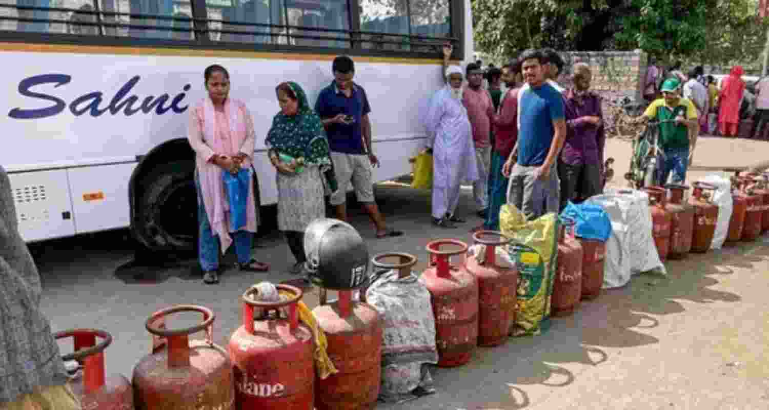People stand in queue to avail LPG cylinders - file image.