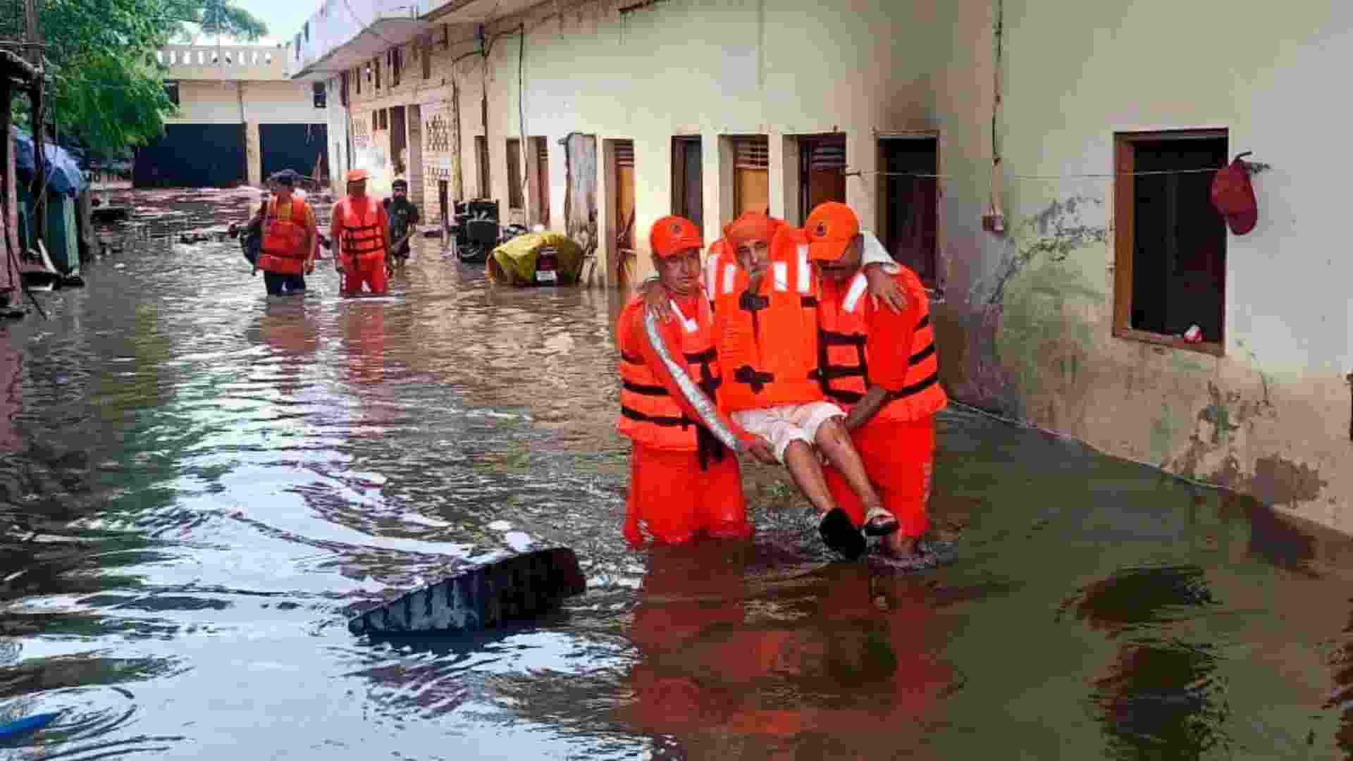 NDRF personnel during a rescue operation at a flood-affected area, in Punjab.