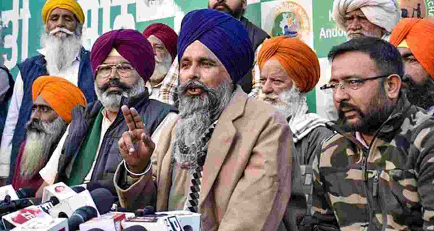 Punjab farmer leader Sarwan Singh Pandher with others addresses a press conference at the Shambhu Border amid the ongoing protest by farmers.