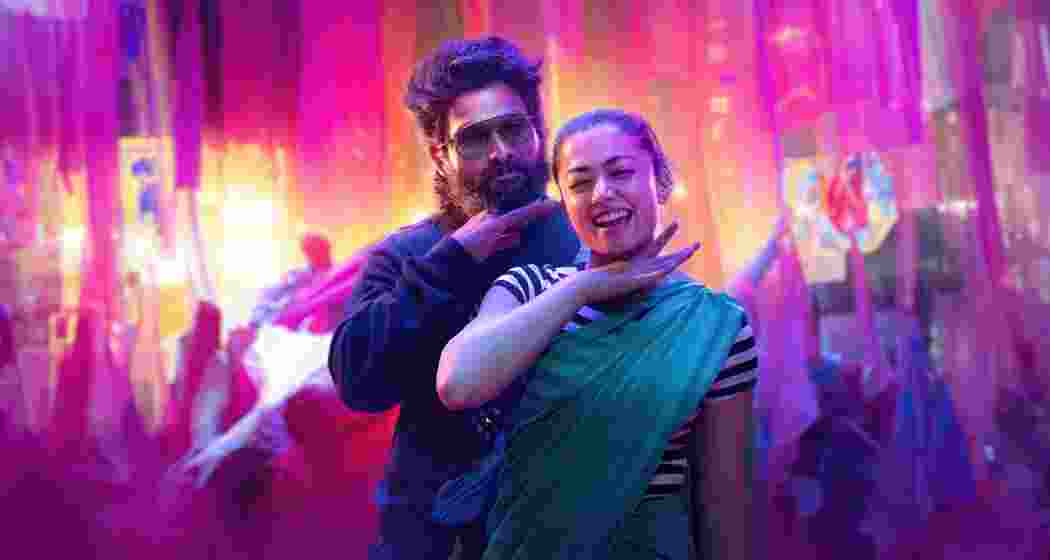 Allu Arjun and Rashmika Mandanna strike a pose during a vibrant dance shoot for Pushpa 2: The Rule, showcasing their dynamic chemistry.