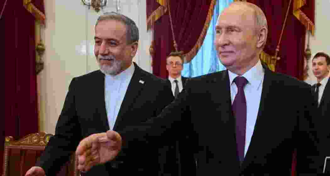 Iranian Foreign Minister Abbas Araghchi with Russian President Vladimir Putin in Moscow on Monday.