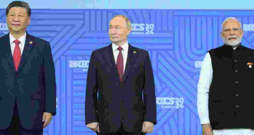 From left, Xi Jinping, China’s top leader, President Vladimir V. Putin of Russia and Prime Minister Narendra Modi of India at the BRICS summit in Kazan, Russia, on Wednesday. Credit...Sergey Bobylev/BRICS-Rossia2024.ru, via EPA, via Shutterstock