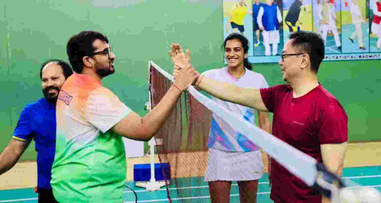 PV Sindhu, Venkata Datta and Kiren Rijiju play badminton in Delhi.