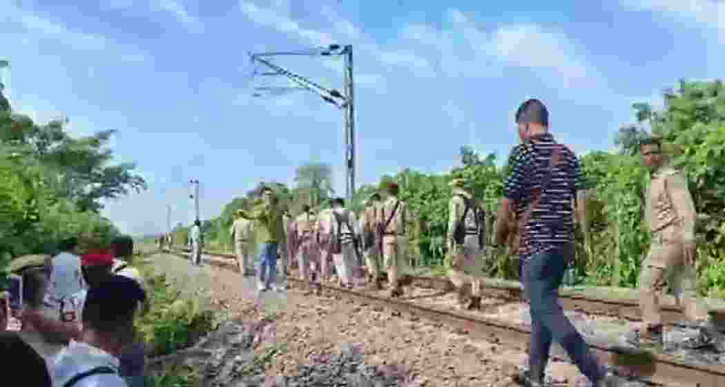 Railway personnel patrol the area near Kokrajhar in Assam after a suspected IED explosion damaged the track and disrupted services overnight, before operations resumed following emergency repairs.