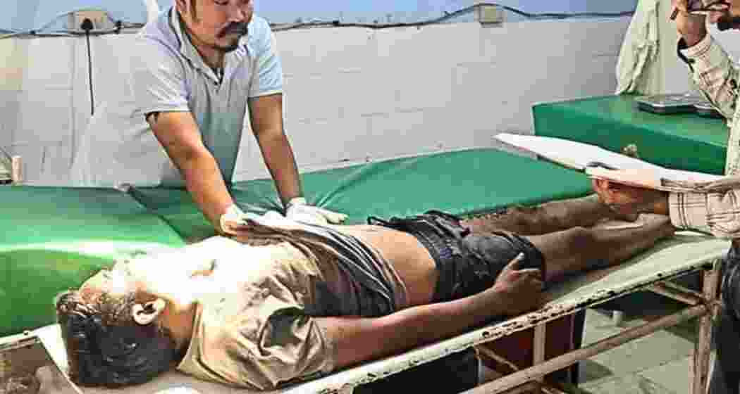 The body of the suspected Maoist being scrutinized after the Kokrajhar encounter.