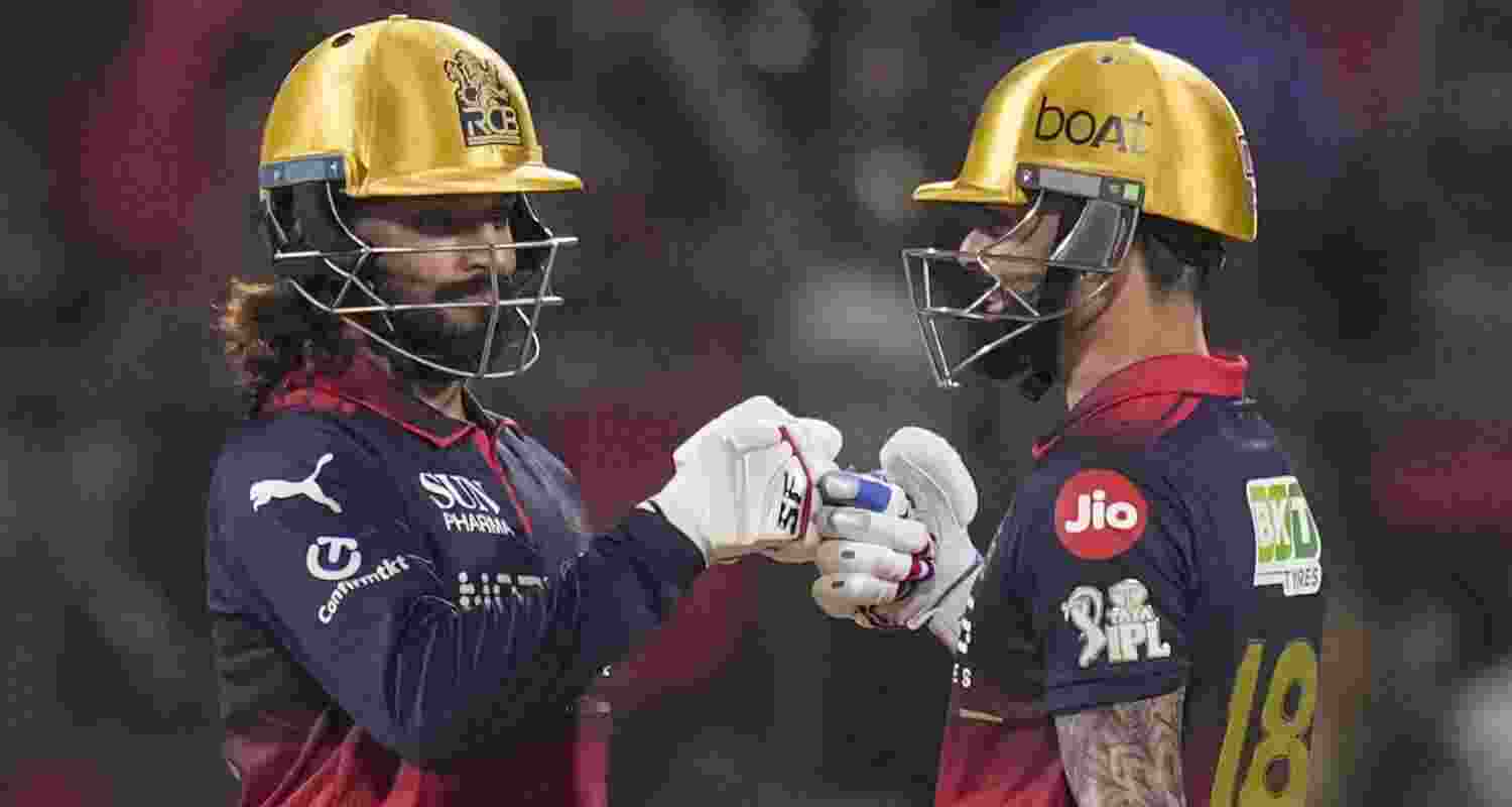 Royal Challengers Bengaluru's captain Rajat Patidar, left, and Virat Kohli during the Indian Premier League (IPL) 2026 T20 cricket match between Royal Challengers Bengaluru and Lucknow Super Giants, at M Chinnaswamy Stadium in Bengaluru, Karnataka, Wednesday, April 15, 2026.