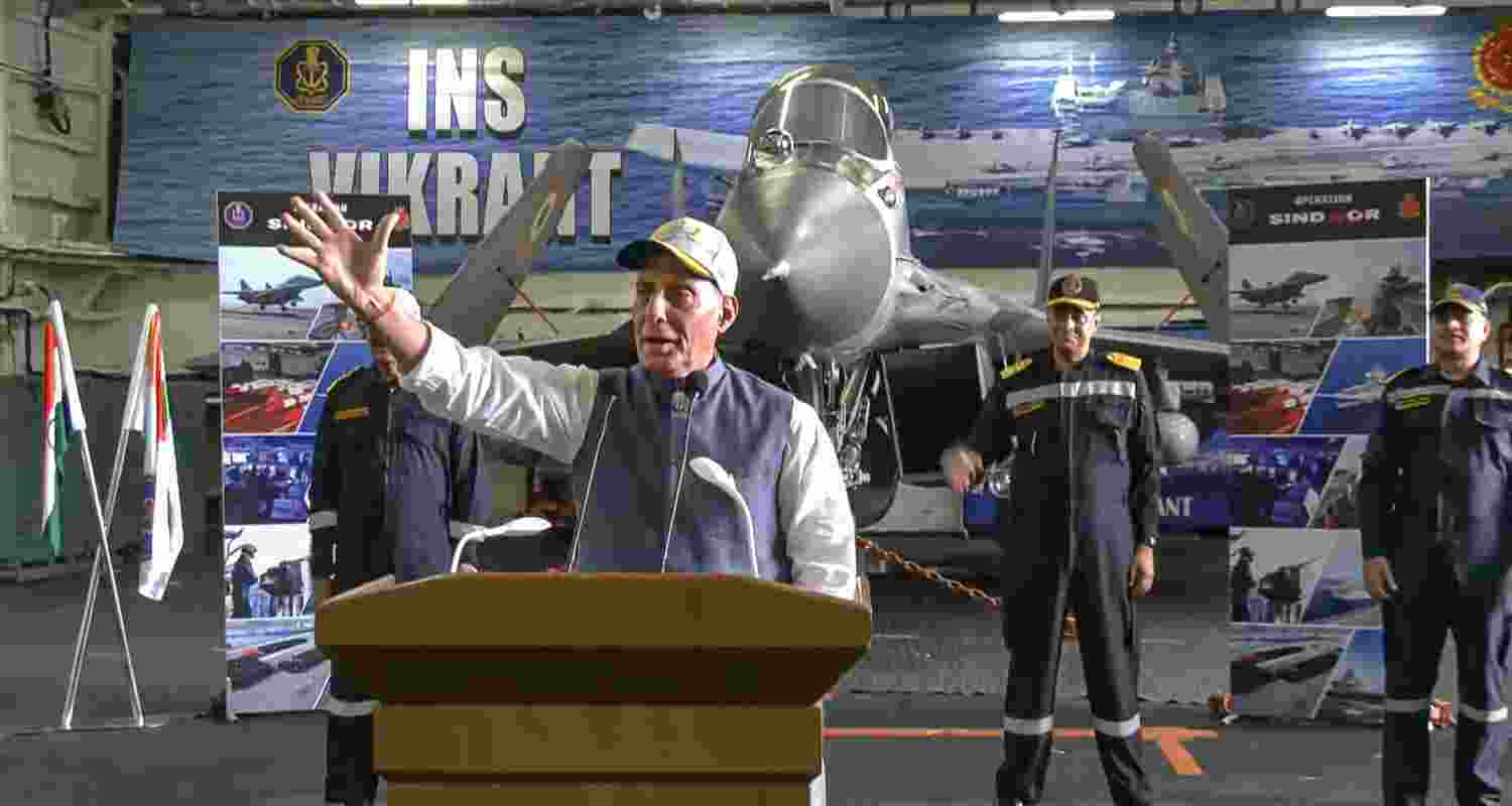 Union Defence Minister Rajnath Singh addresses naval officers during an interaction aboard aircraft carrier INS Vikrant. 