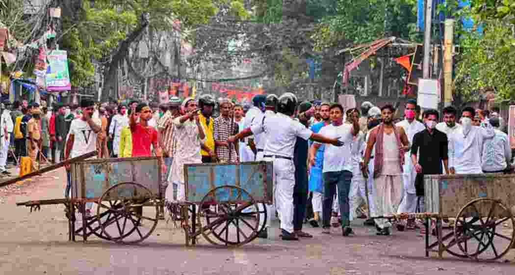 Police personnel attempt to restore order during a Ram Navami procession in Howrah following a clash that broke out in 2024, leading to heightened tensions and swift security intervention this year.