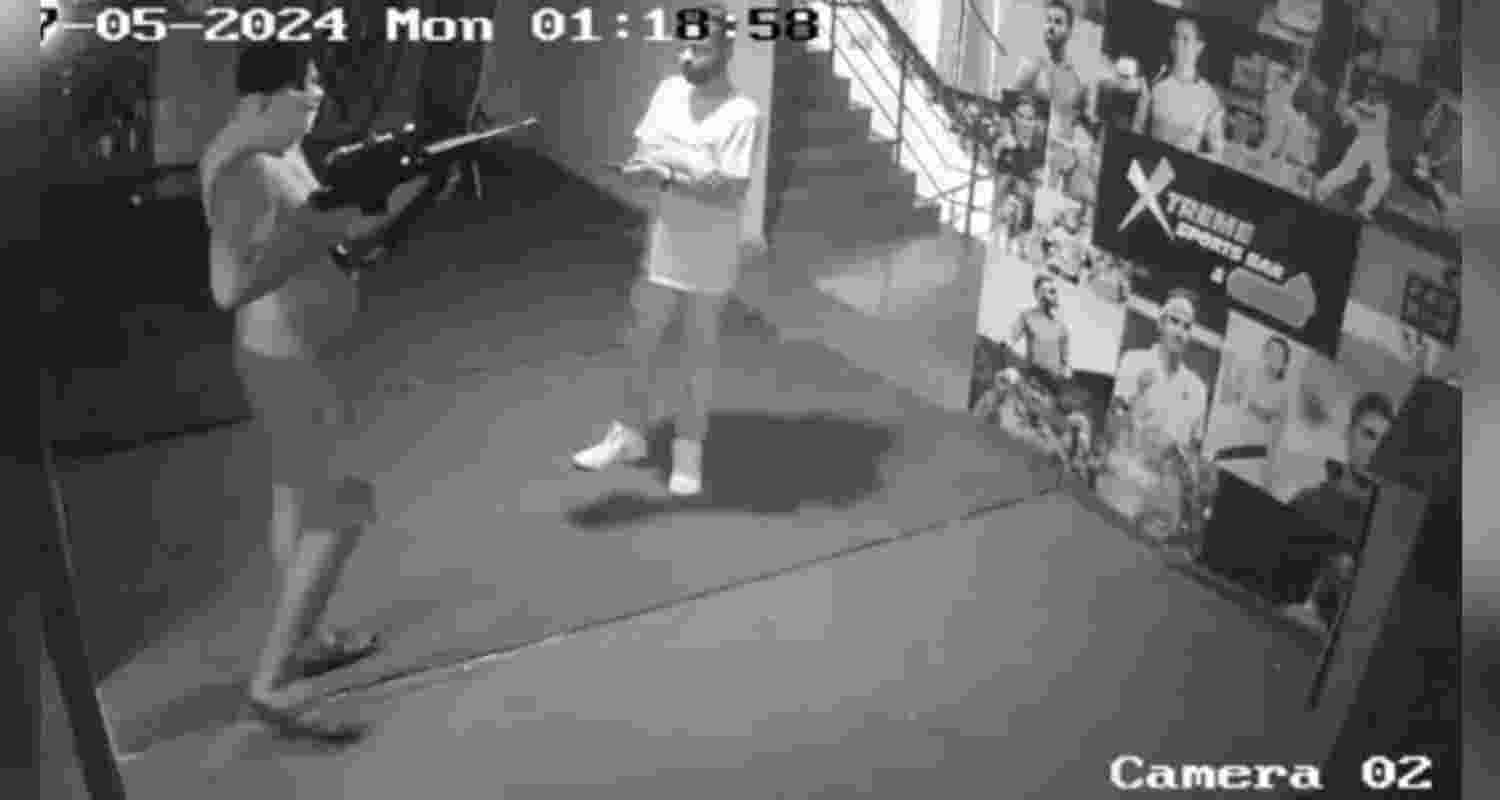 CCTV footage captured a bare-bodied man, his face concealed with a T-shirt, approaching the DJ at 1:18 am on Monday, brandishing a rifle.