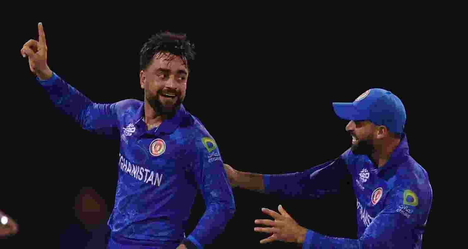 Rashid Khan celebrates Kane Williamson's dismissal.