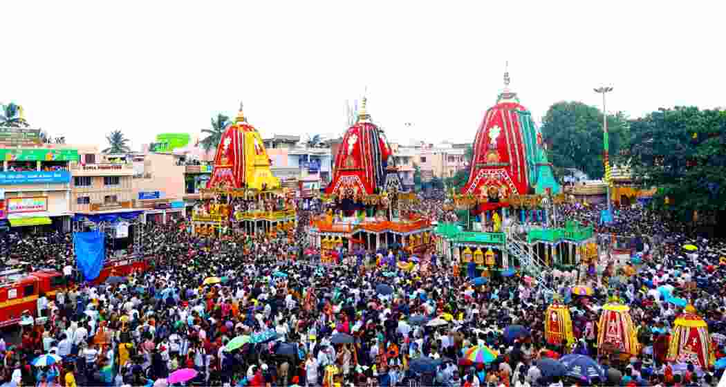 Devotees queue near Shree Gundicha Temple in Puri on Sunday, after a stampede killed three. Authorities erected barricades and deployed senior police to oversee crowd management.