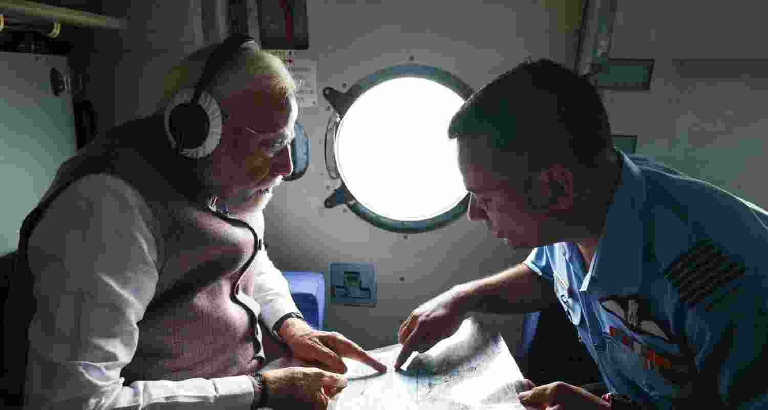 Prime Minister during an aerial survey of the severely affected Mandi and Kullu districts to review the situation caused by floods and landslides.