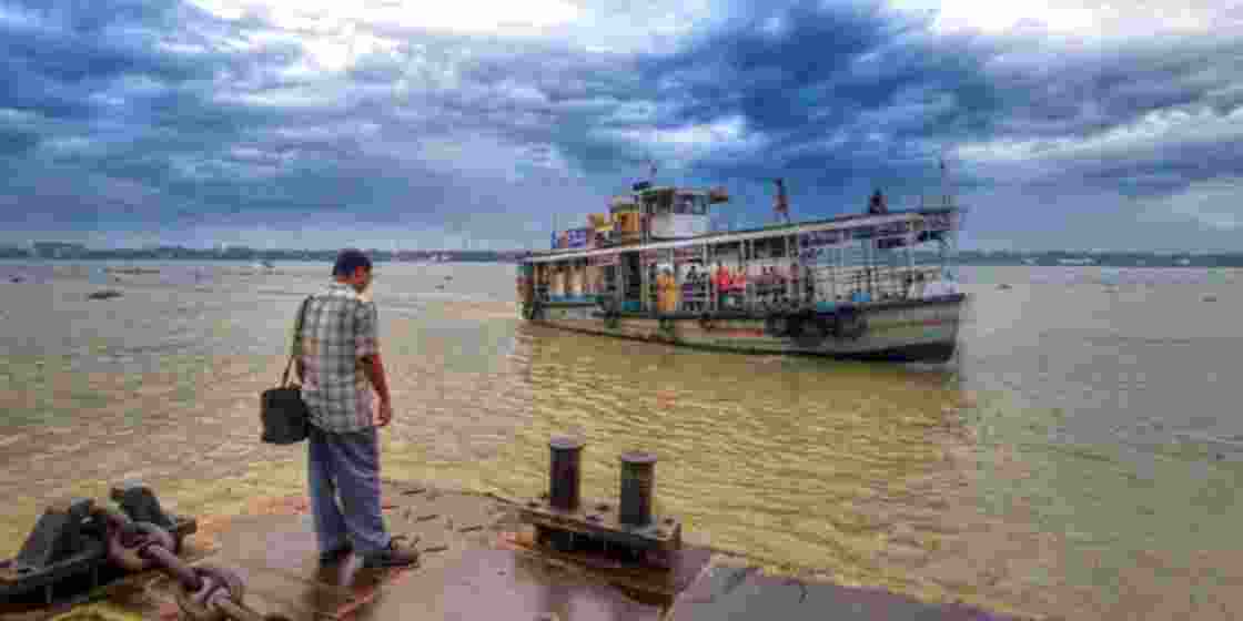 A man waits for a ferry at Kolkata’s Babu Ghat. 