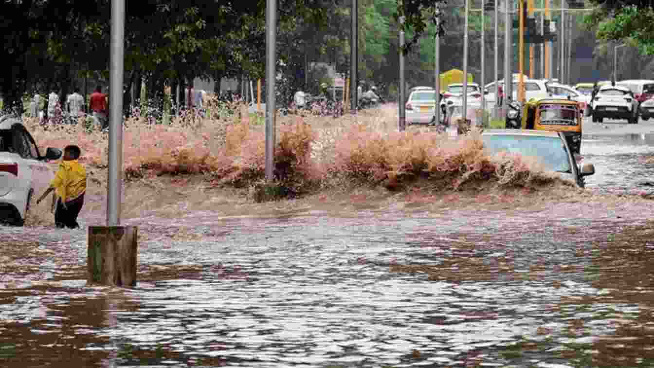 Vehicles navigated through the waterlogged Madhya Marg near Sector 26 in Chandigarh.