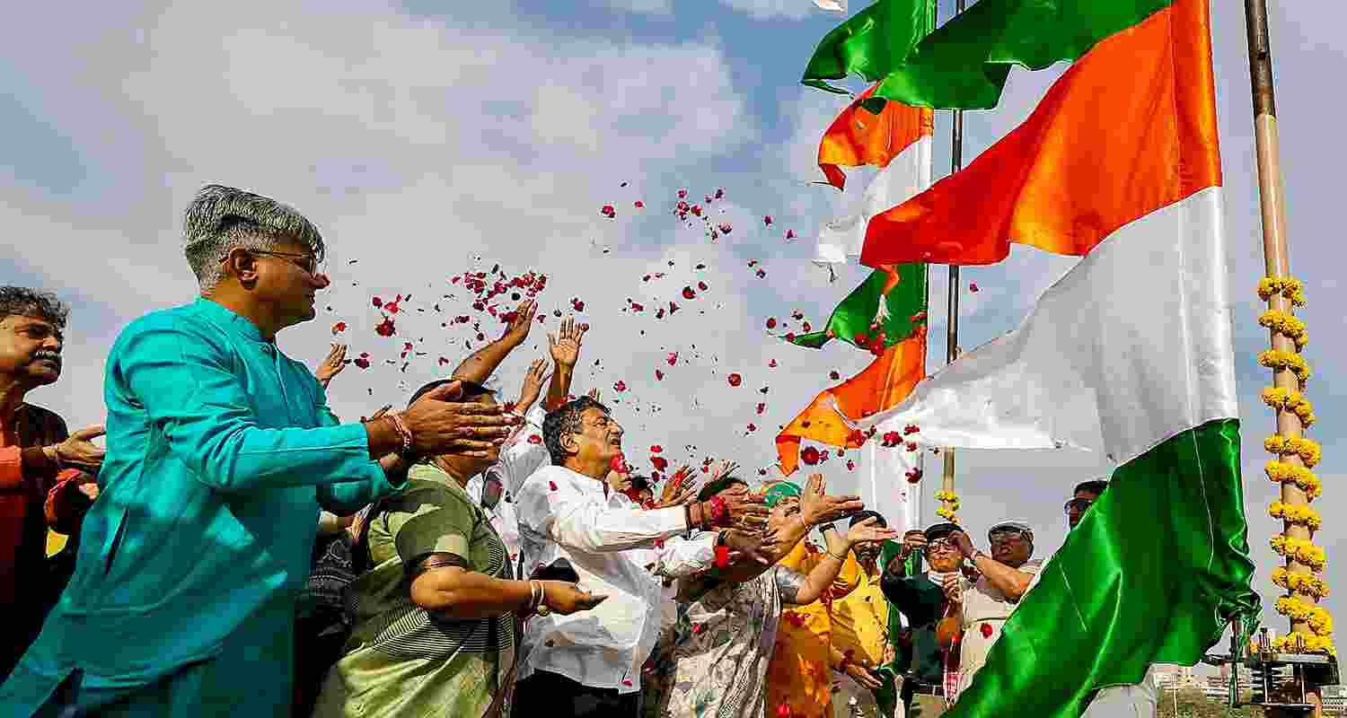 People pay floral tribute to Hindu saint Maneknath on his birth anniversary, at Manek Burj in Ahmedabad, Gujarat