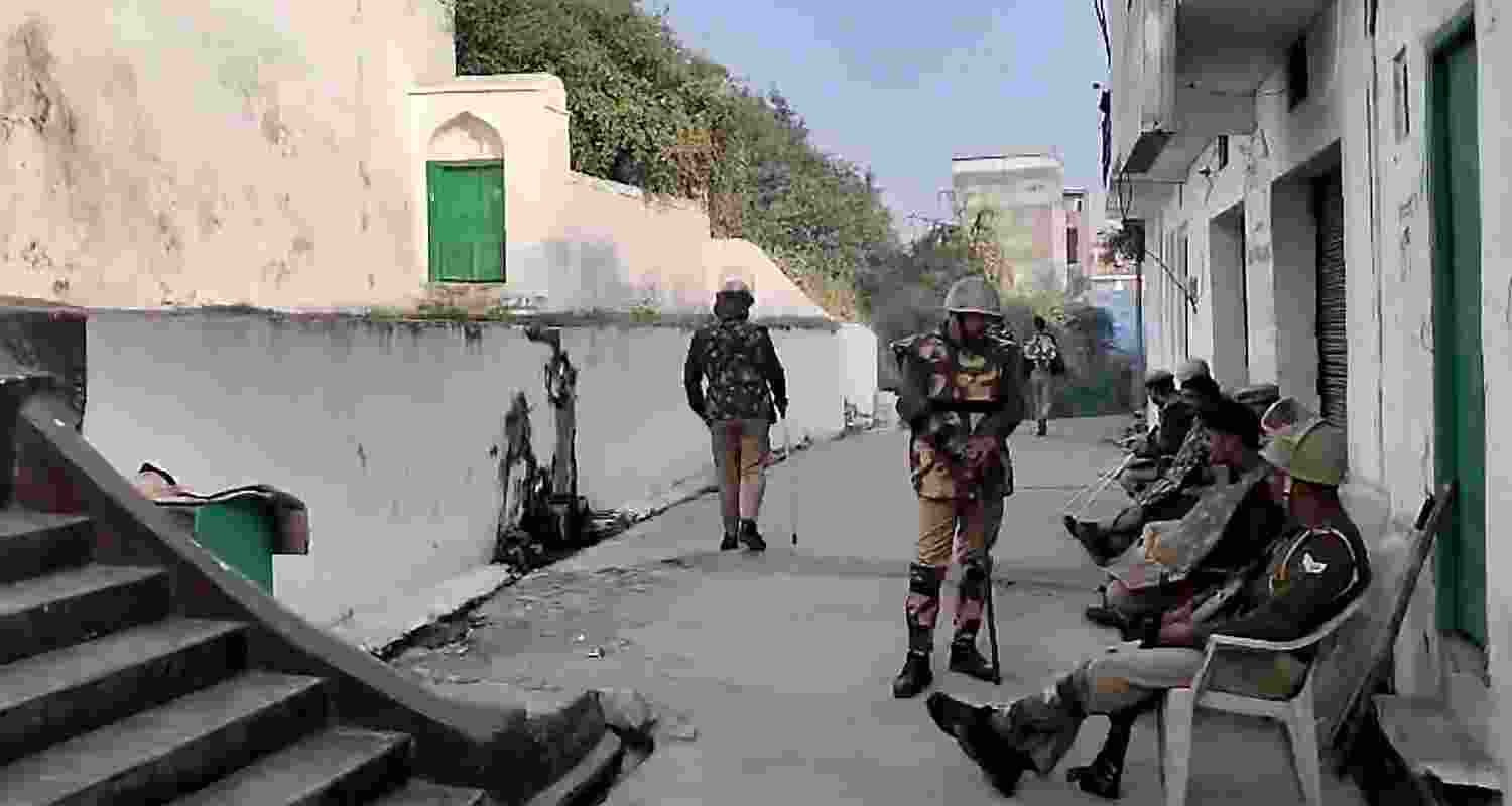 Police and security personnel stand guard near the Shahi Jama Masjid ahead of Friday prayers in Sambhal.