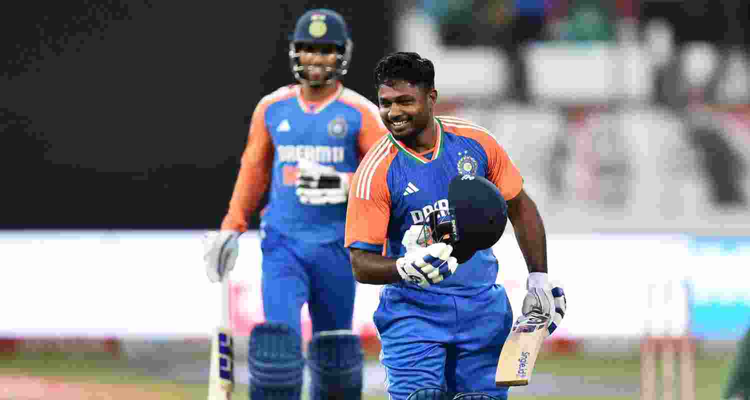 Indian opener Sanju Samson celebrates his century.