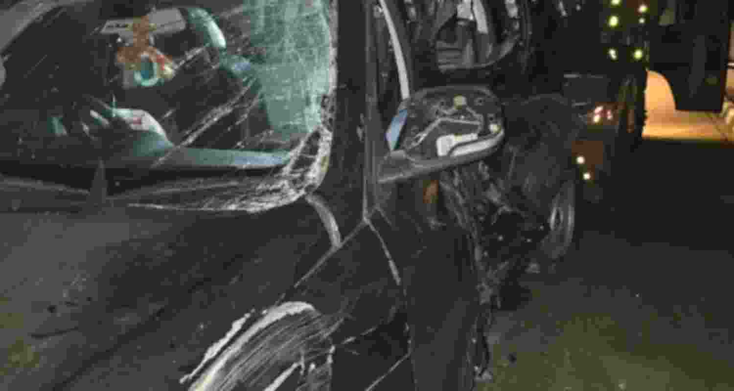 Wreckage of a car being towed away after an accident at the Agra-Lucknow Expressway, in Kannauj district.