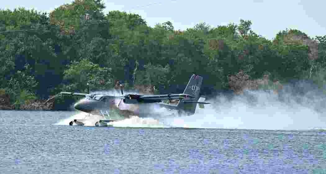A seaplane lands on the Krishna River near Punnami Ghat, Vijayawada.