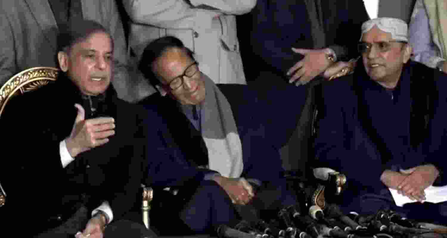 Former Pakistan PM Shahbaz Sharif addressing reporters at his residence.